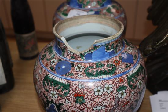 A pair of Chinese porcelain wucai jars and covers, late 19th/early 20th century height 36cm (a.f.)